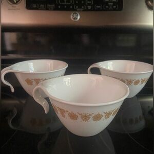 CORELLE by Corning teacups in Butterfly Gold, set of three.